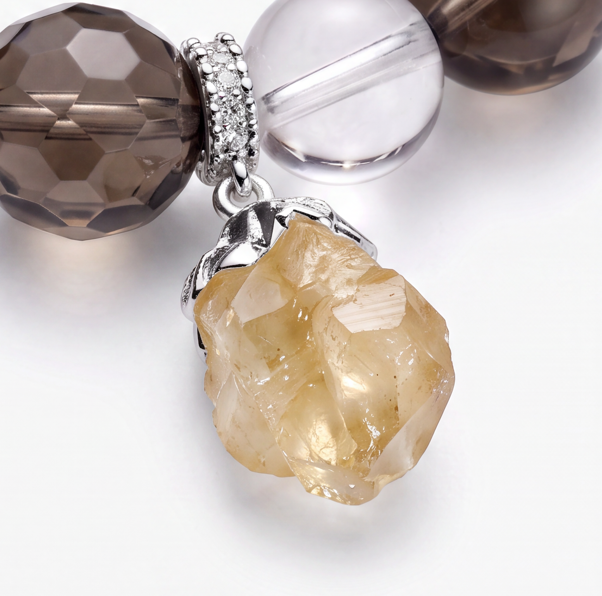 Natural citrine raw crystal pendant detail on handmade gemstone bracelet